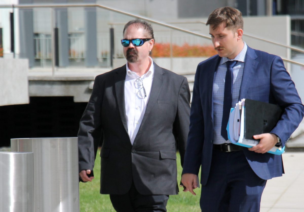 Two men walking to court 