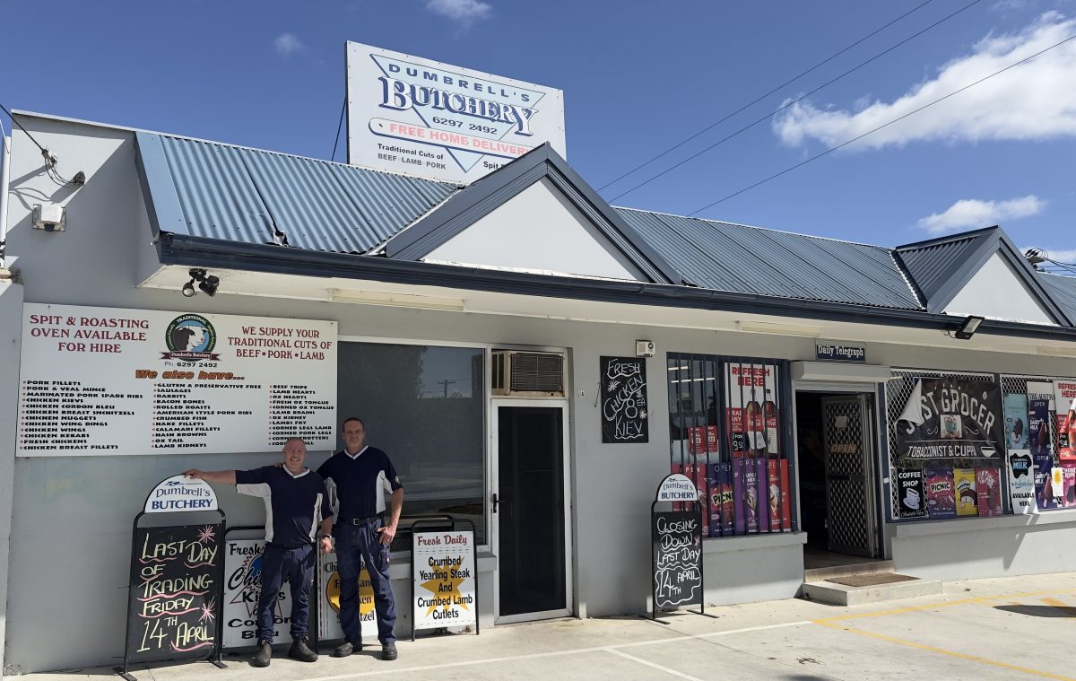 Steve and Daniel stand outside Dumbrell's Butchery.