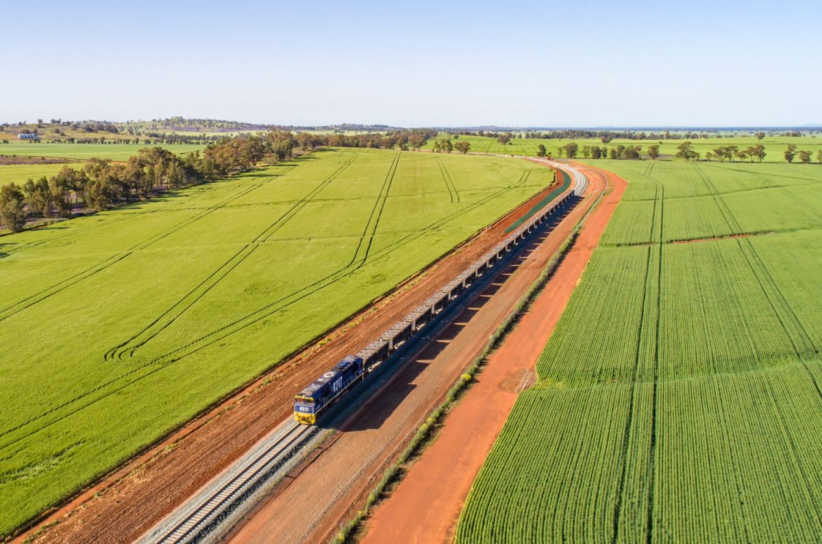 Train travelling past fields