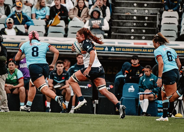 women's rugby game action shot