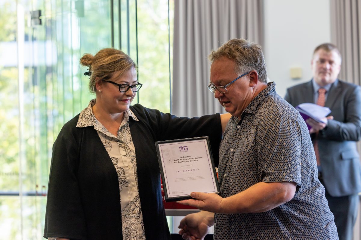 Michael accepting Jo's award on her behalf