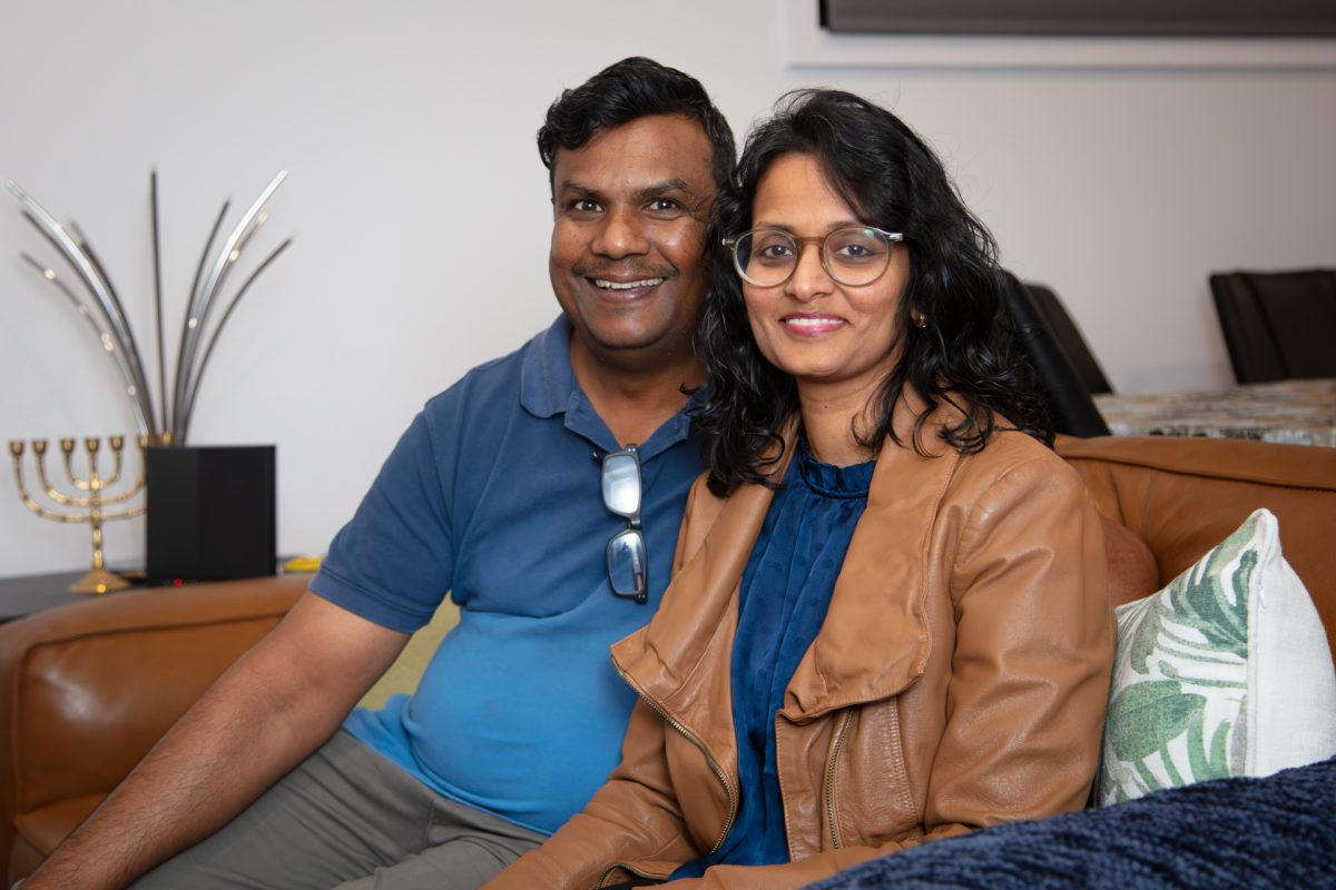 two people sitting on a couch