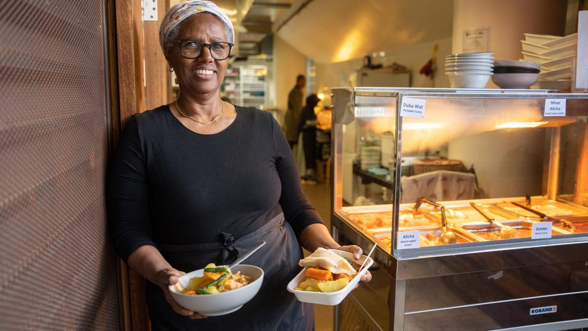 Fekerte Tesfaye holding food