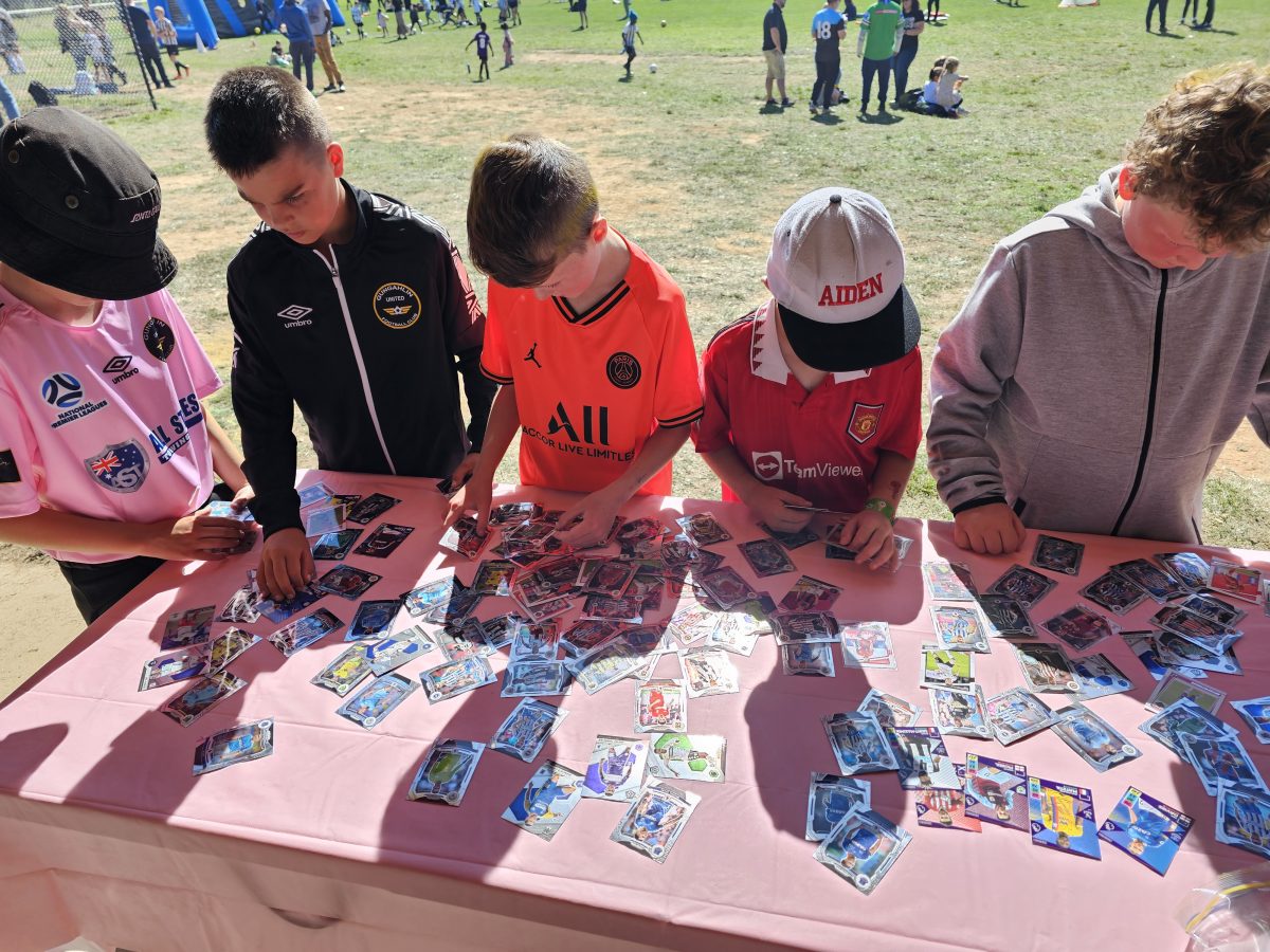 Football stars of the future selecting football cards at the GUFC Fun Day. Photo: GUFC.