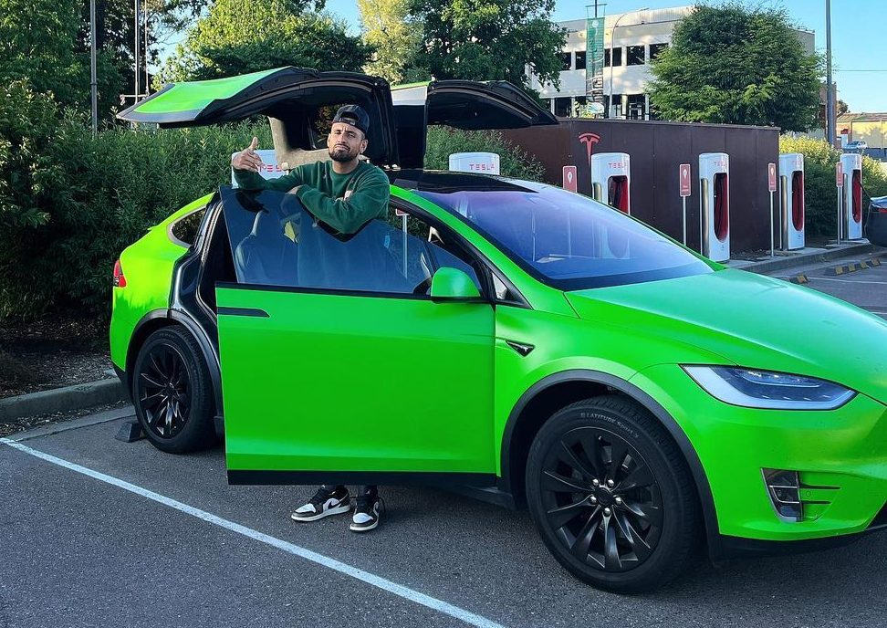 Nick Kyrgios with his green Tesla