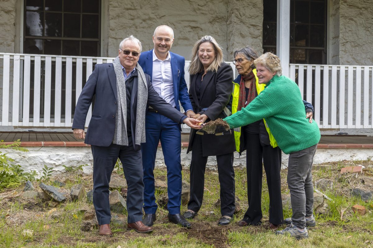 five people at sod-turning ceremony