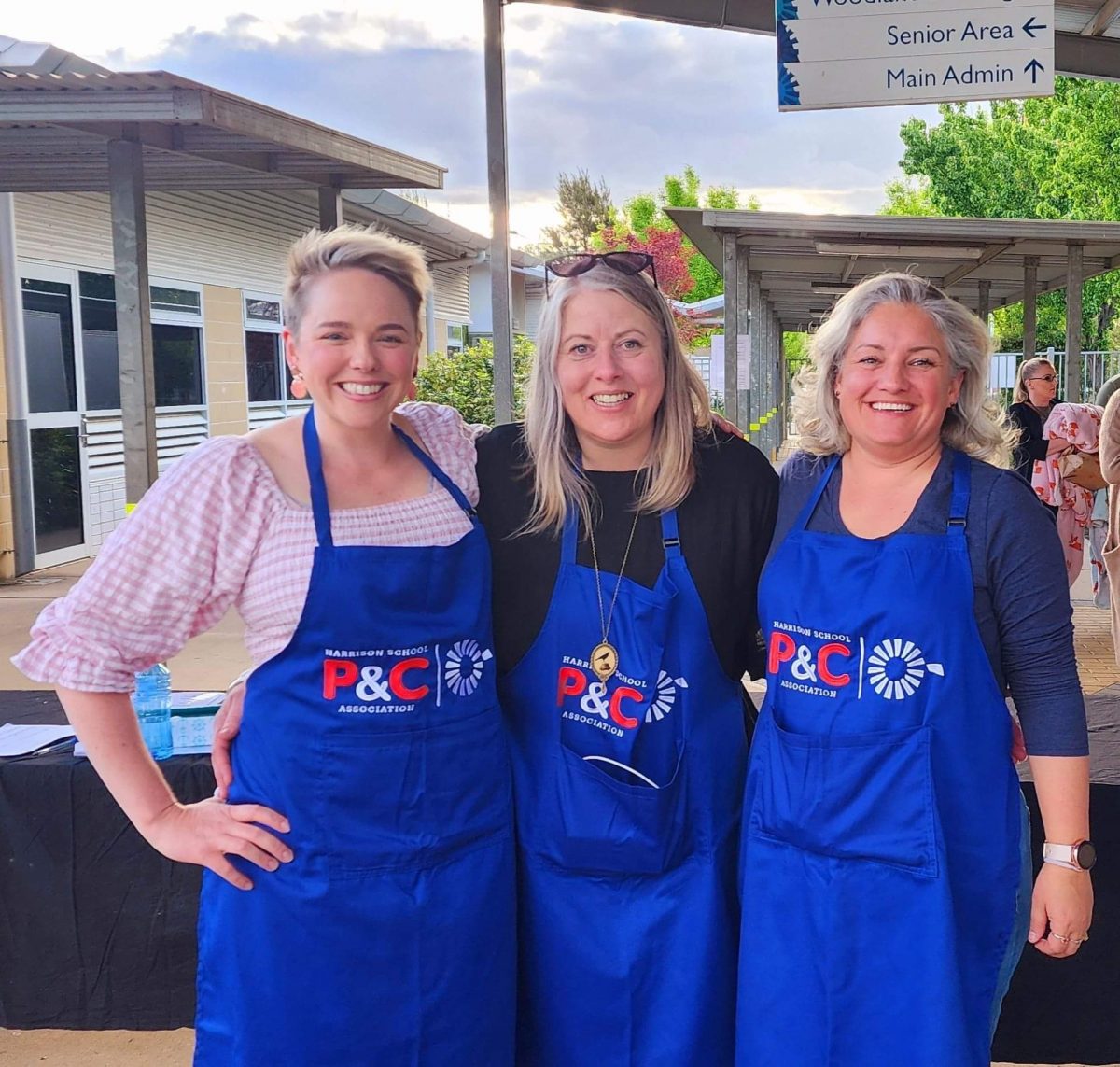 three women in aprons