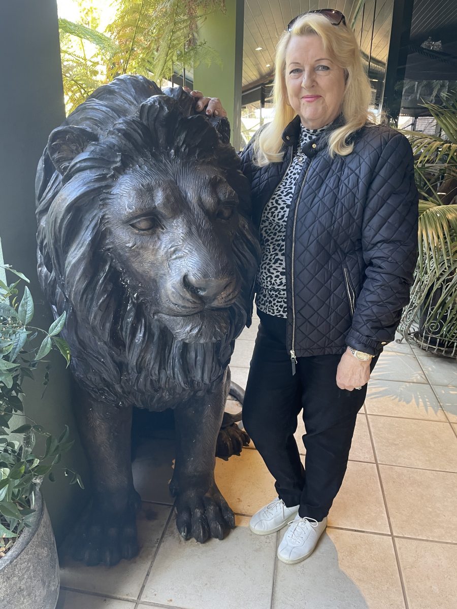 Woman with lion statue