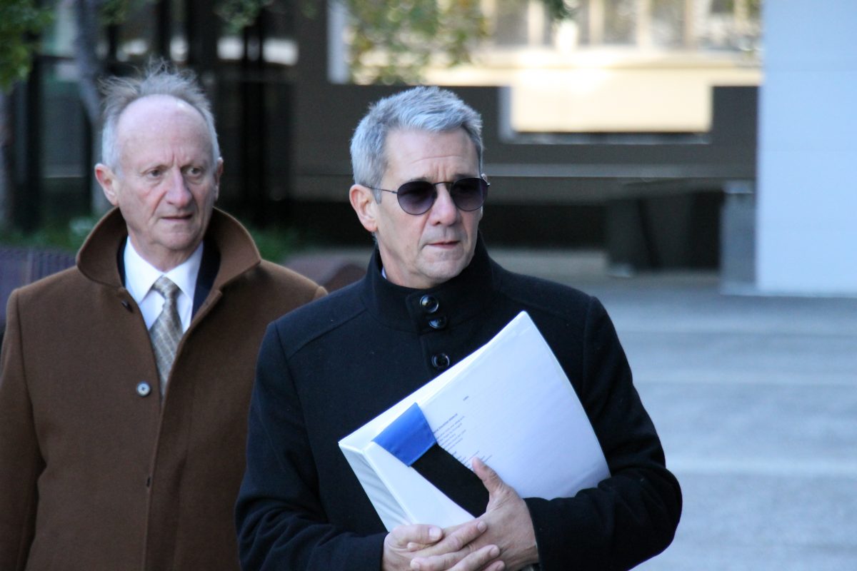 Shane Drumgold in sunglasses walking to court