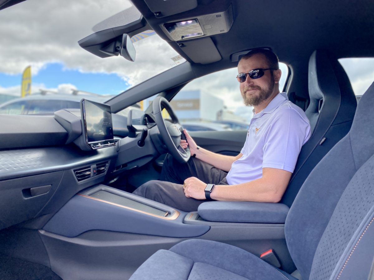 man sitting in a Cupra