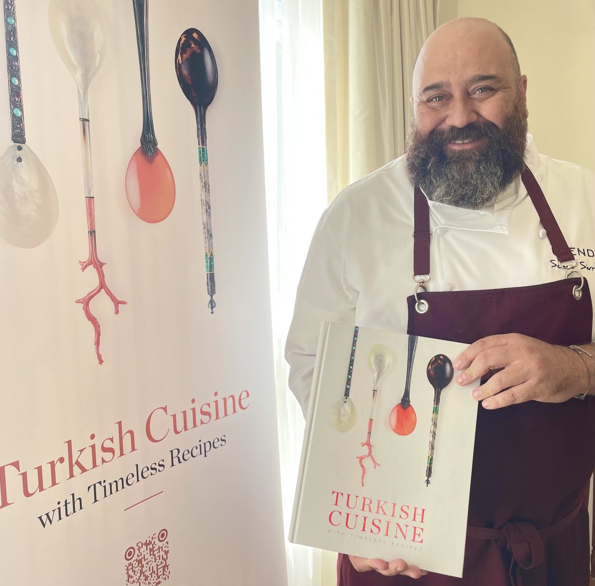 man holding cookbook