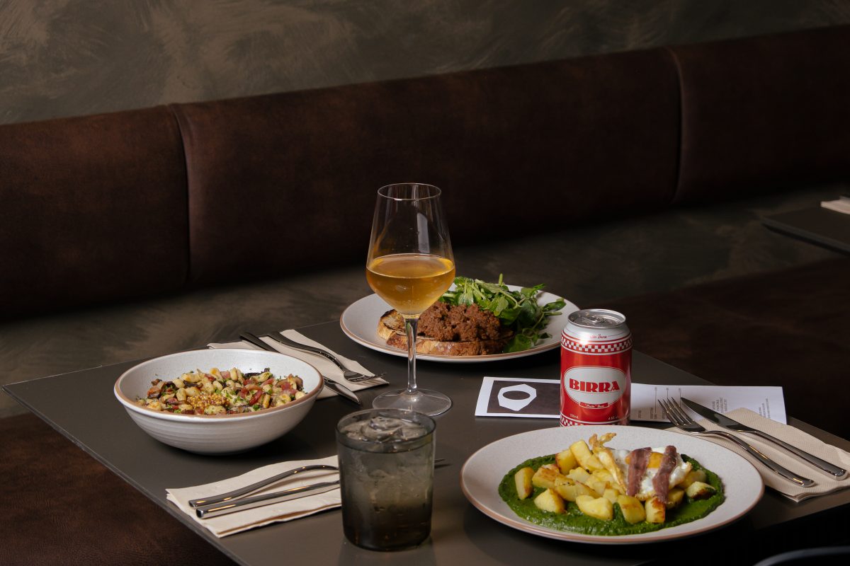 beautifully plated dishes on dark table