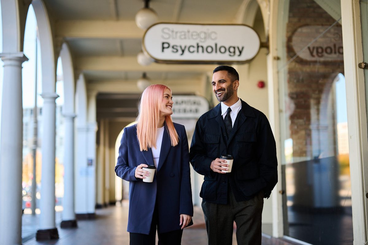 man and woman walking and talking