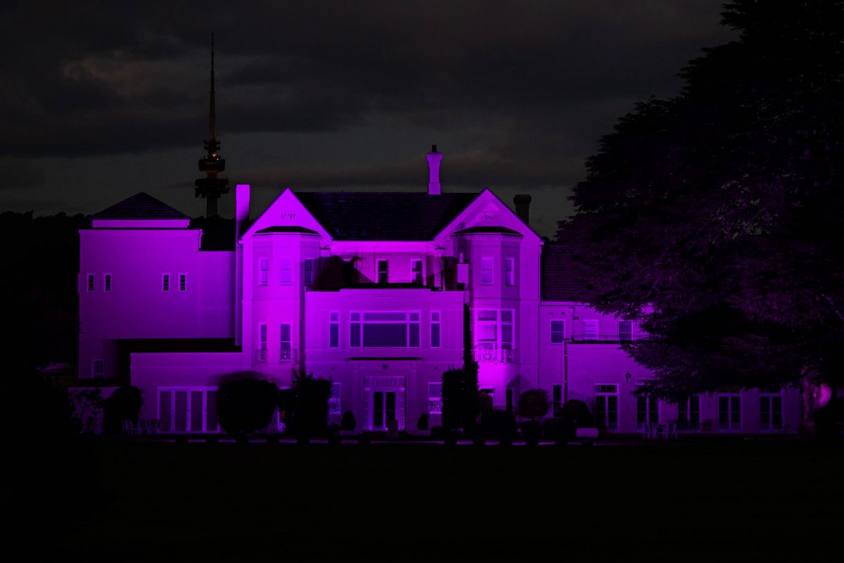 Government House lit in purple light