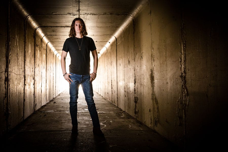 a person standing in a tunnel 