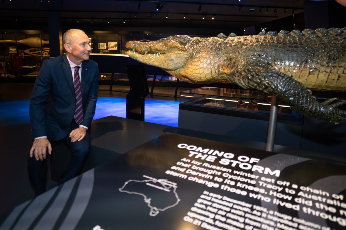 Man with stuffed crocodile