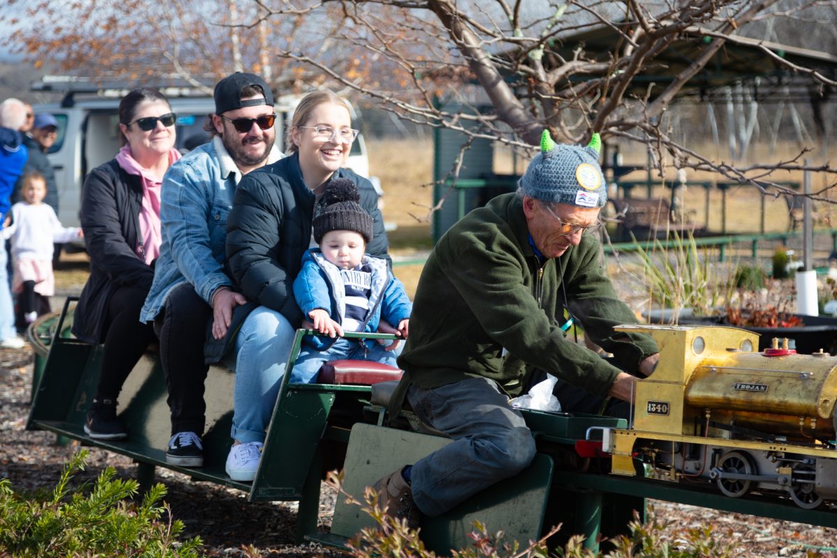 People on a miniature train ride