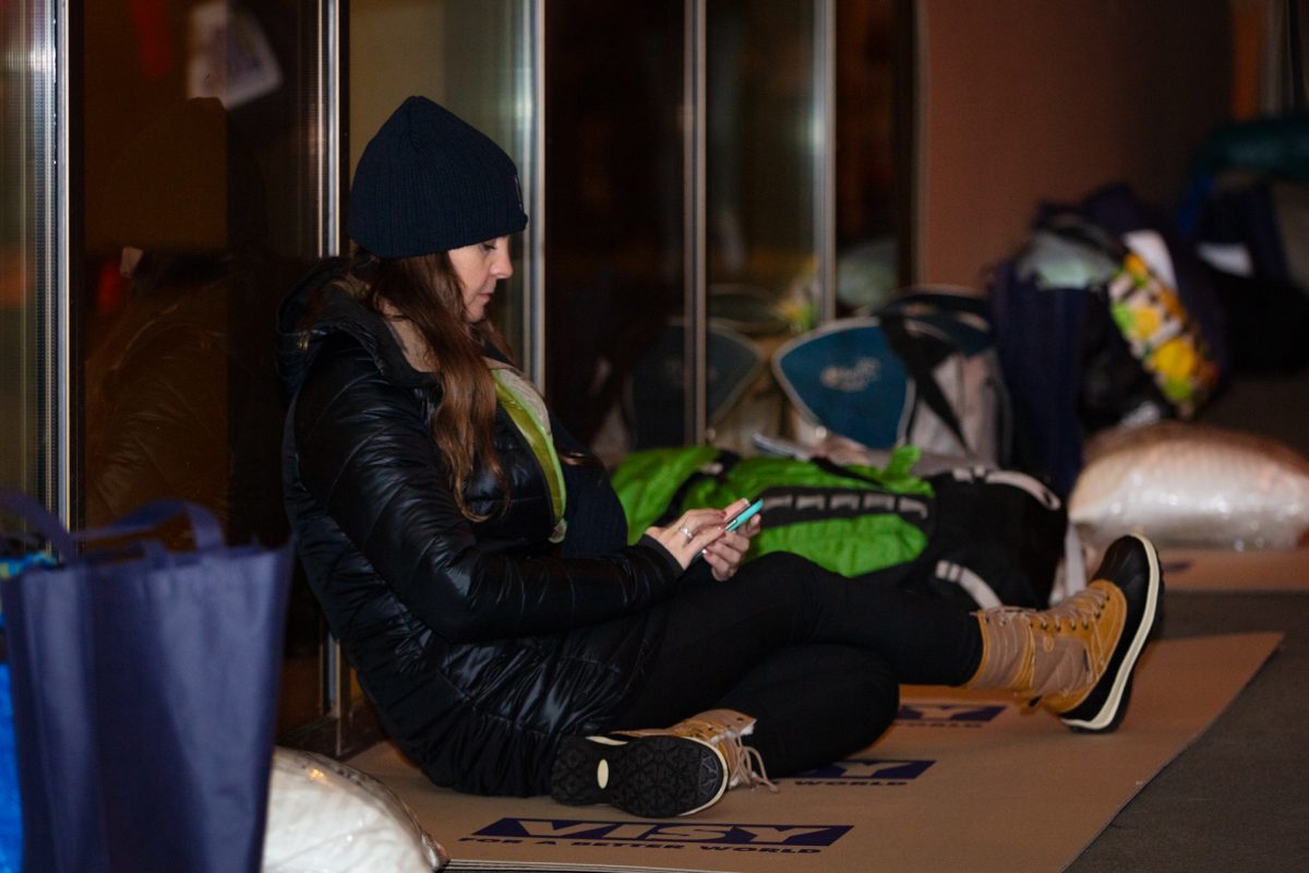 woman sitting outside at night