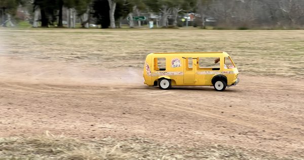 WATCH: Canberra father-son duo see how fast Barbie's bus can go (the results will tickle you pink)