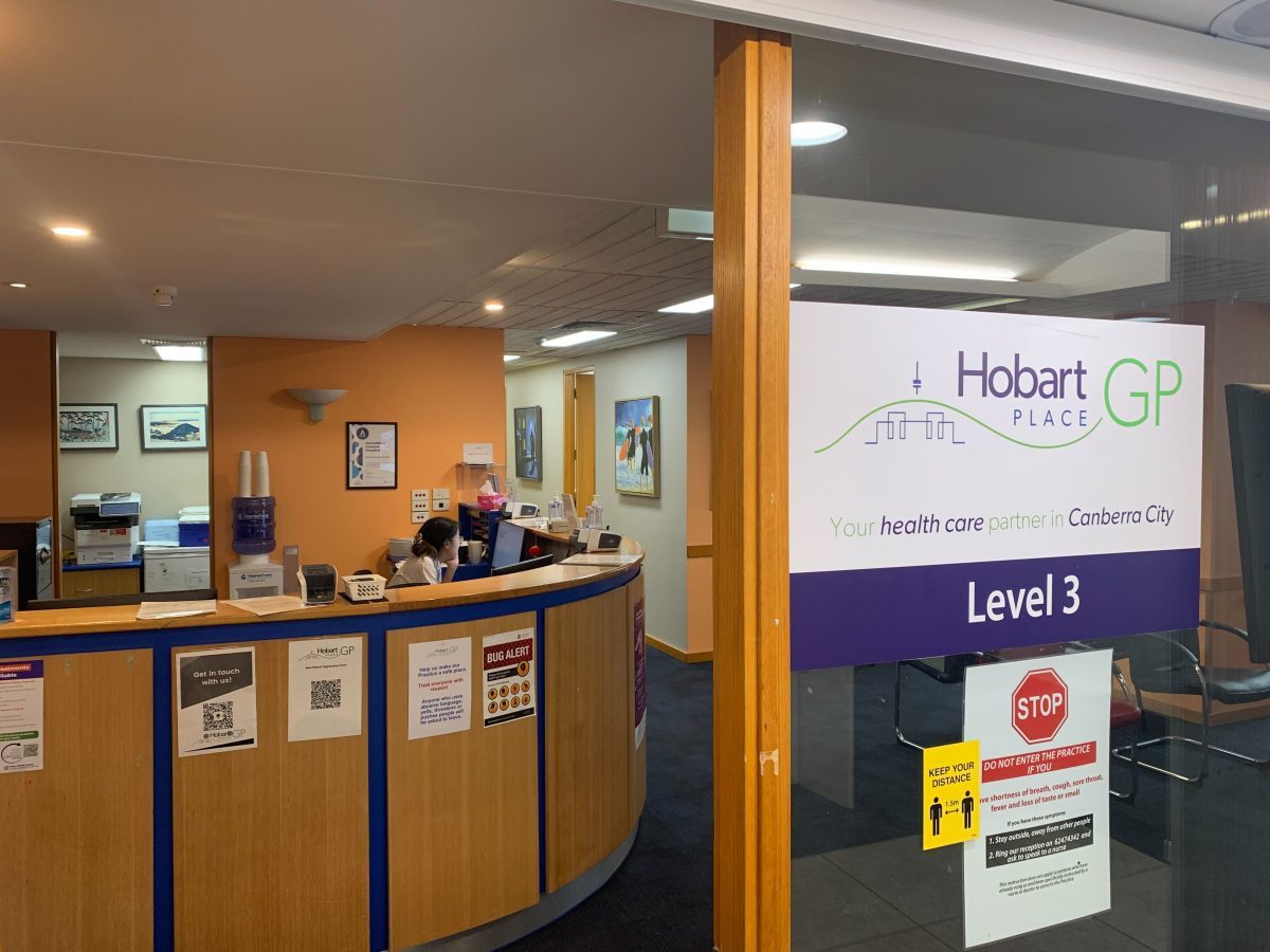 Front of Level 3 entrance to Hobart Place General Practice, showing through the reception desk and waiting area behind the front door.