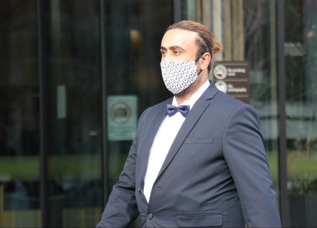 man walking outside court