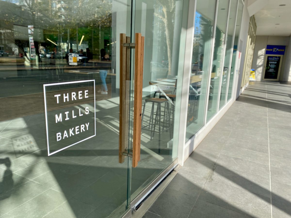 Three Mills Logo on glass door