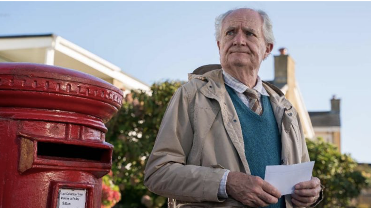 man at postbox