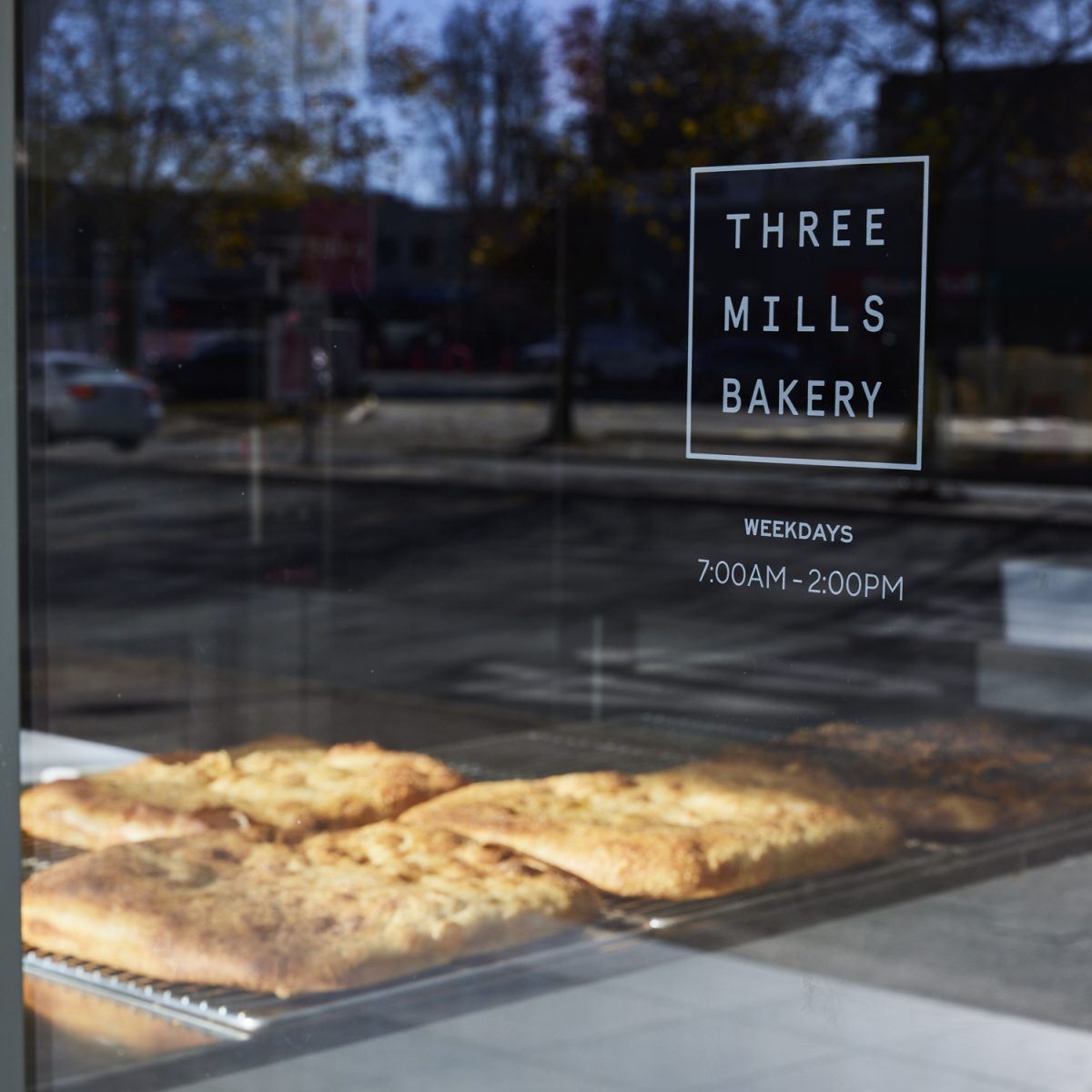 Taglio in the window with Three mIlls logo