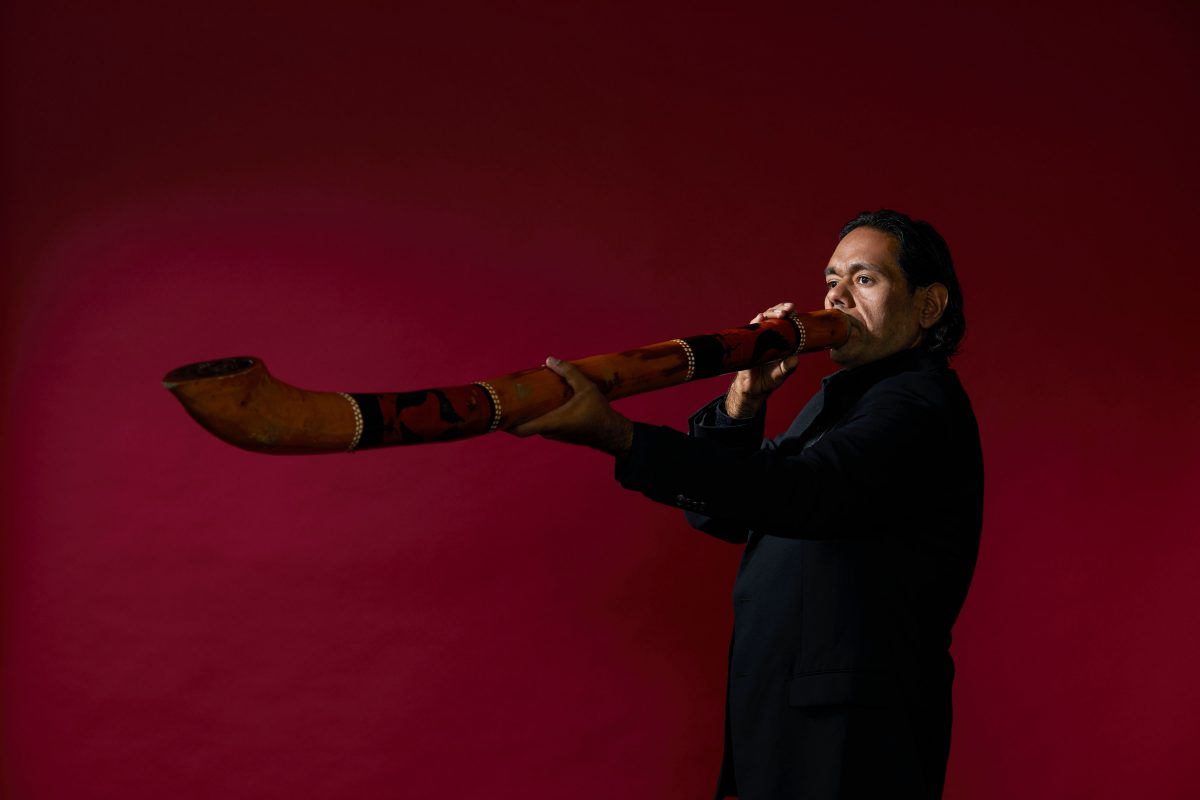 man playing didgeridoo