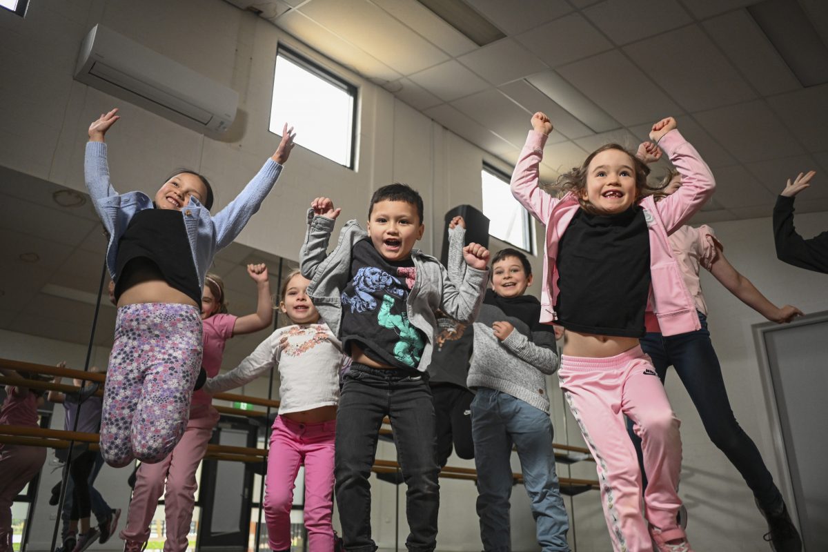 happy children jumping in dance studio