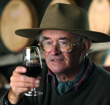 man holding glass of wine