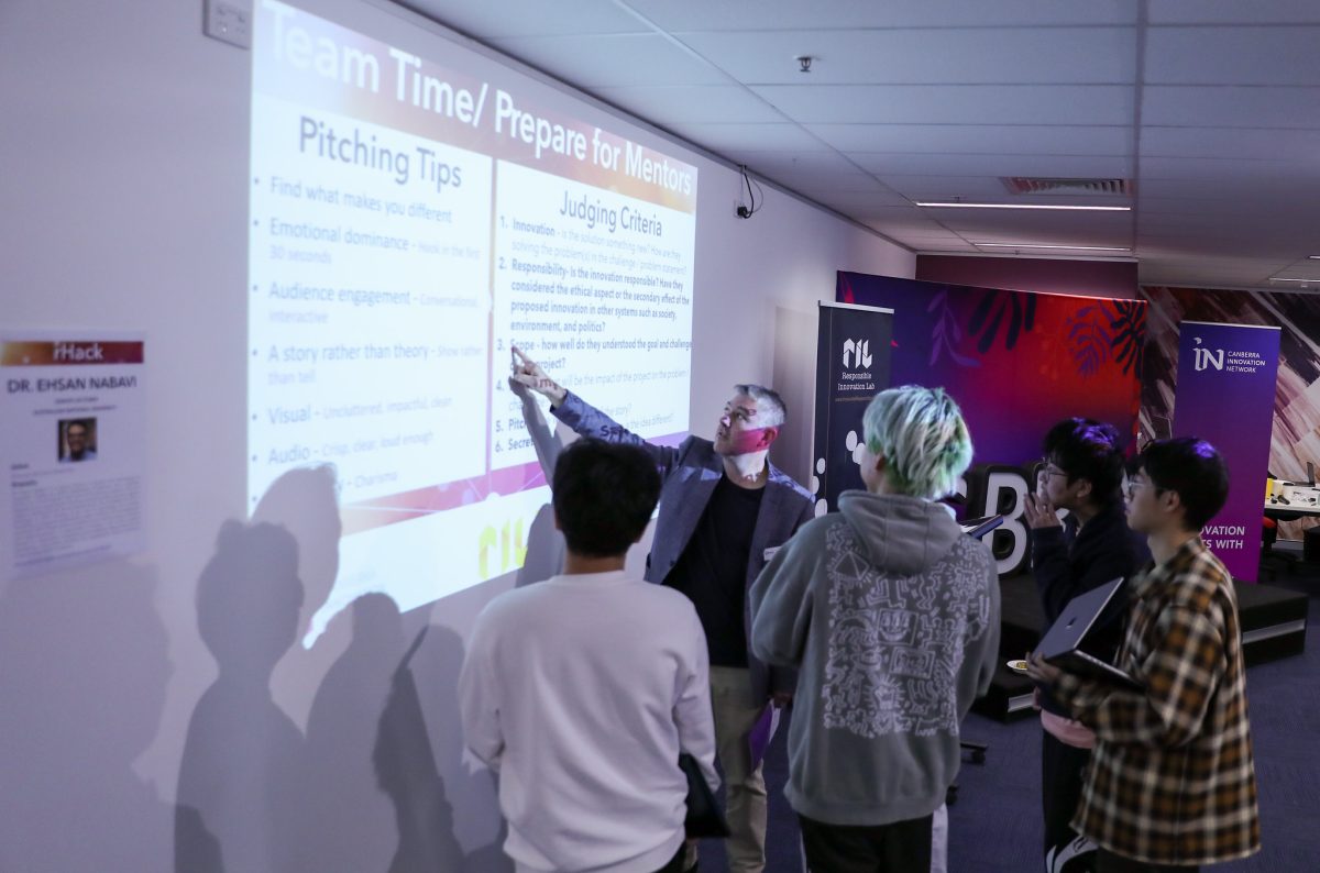 students presenting at hackathon
