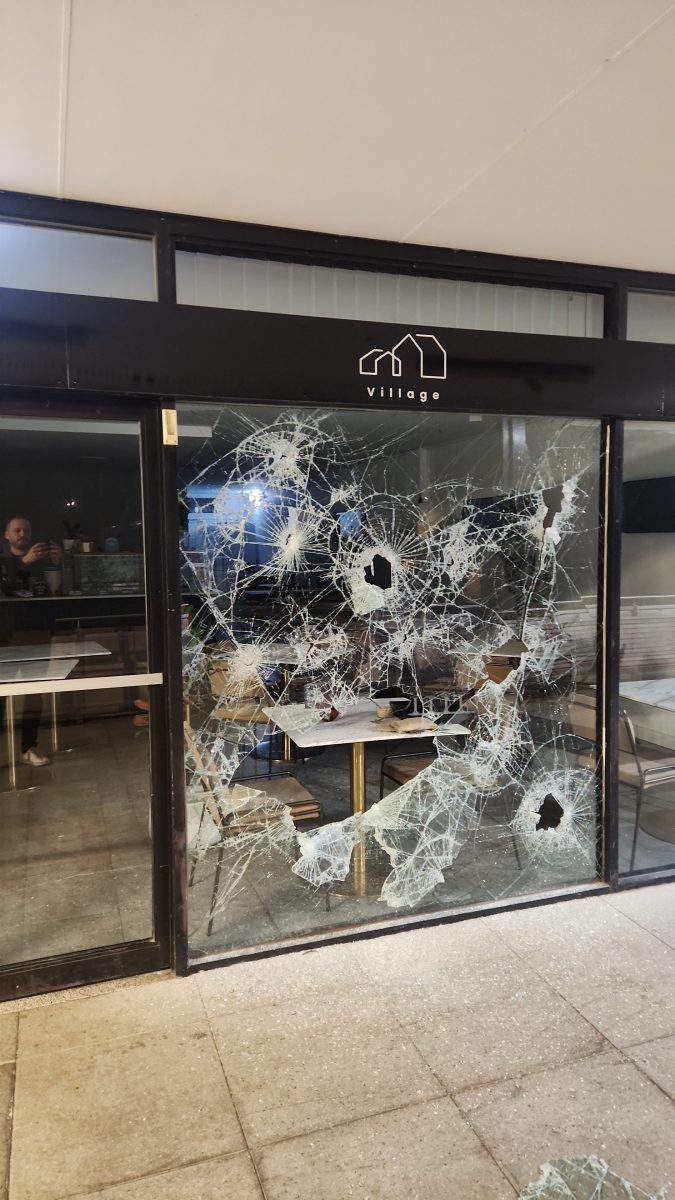 Village Cafe Waramanga damaged shop window