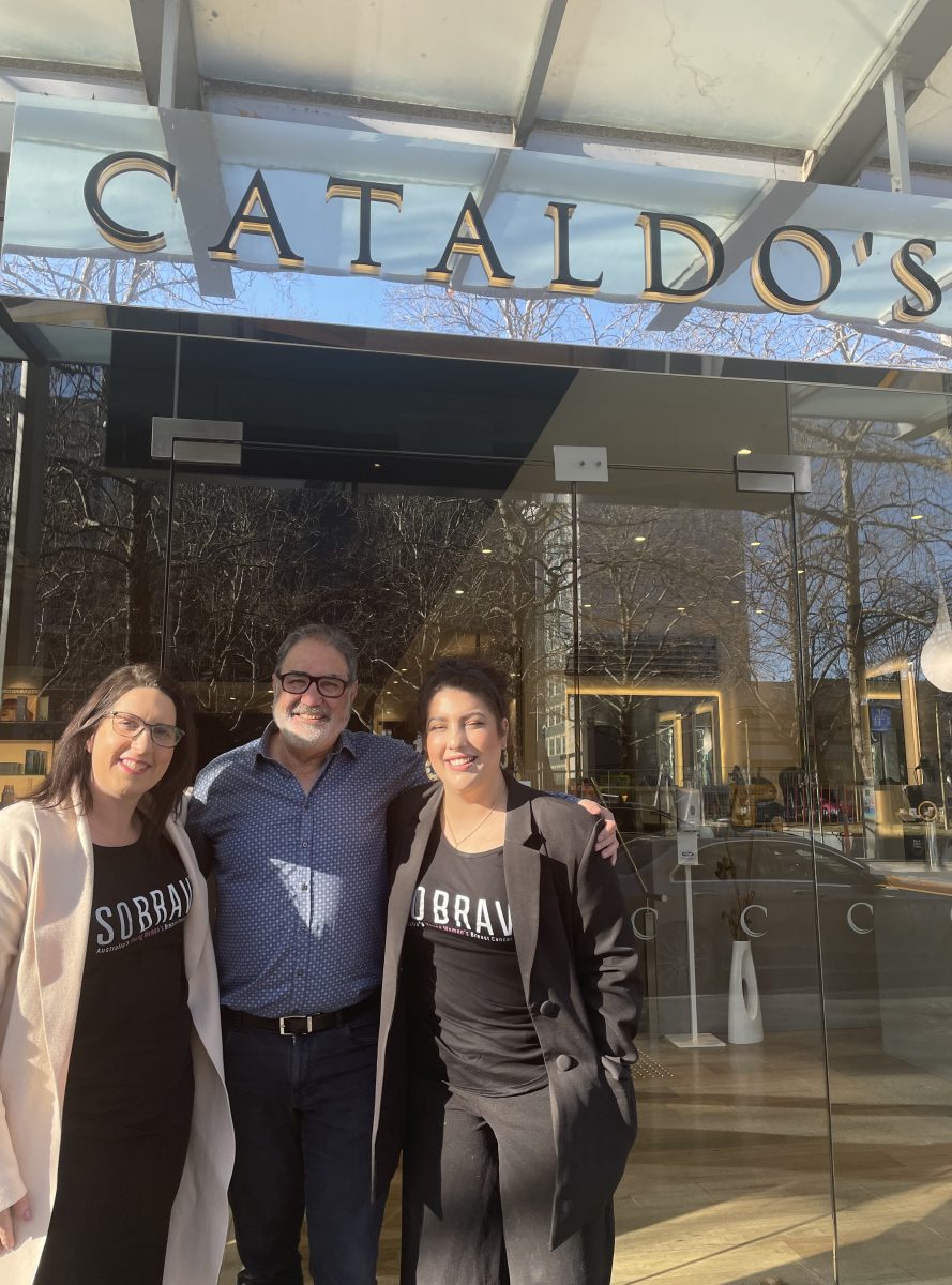 Giulia Jones with Angelo Cataldo and his daughter Claudia under the Cataldo's salon sign.