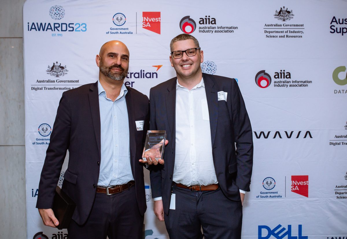 James Meszes and Samuel Ryan accept the Business and Industry Solutions category of the Australian Information Industry Association's iAwards.