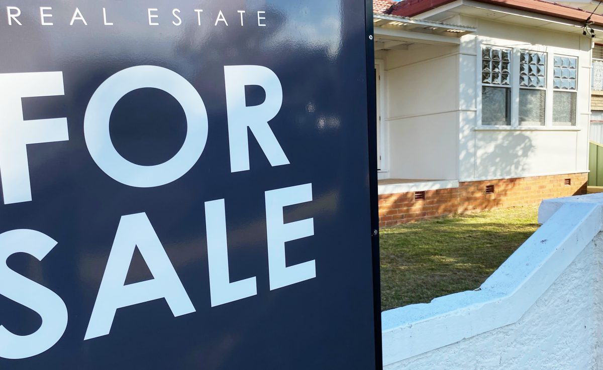 for sale sign outside a house