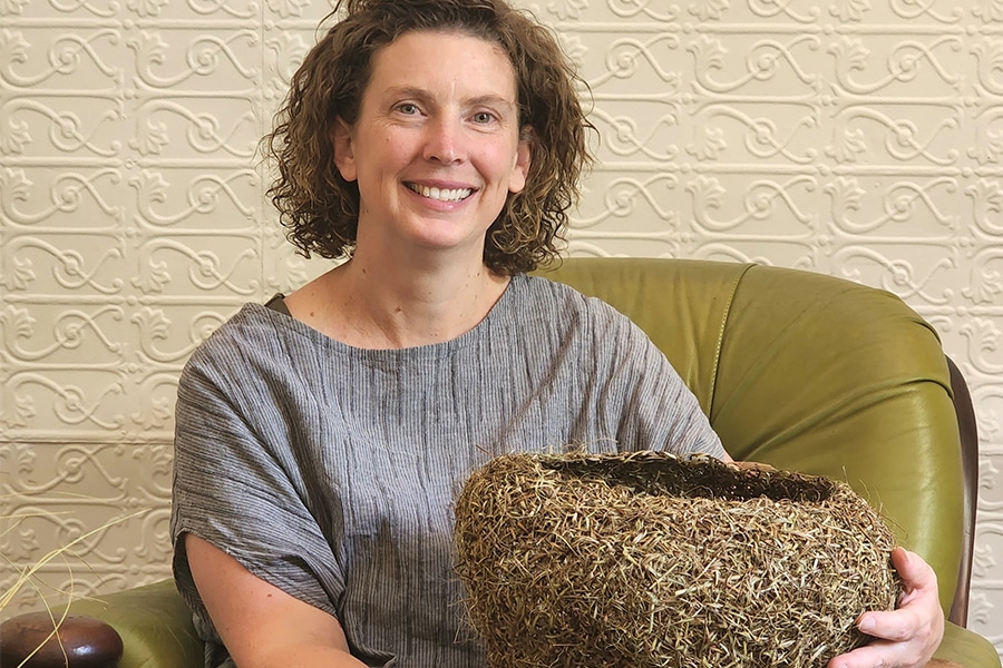 Lisa Stevenson headshot holding a woven basket