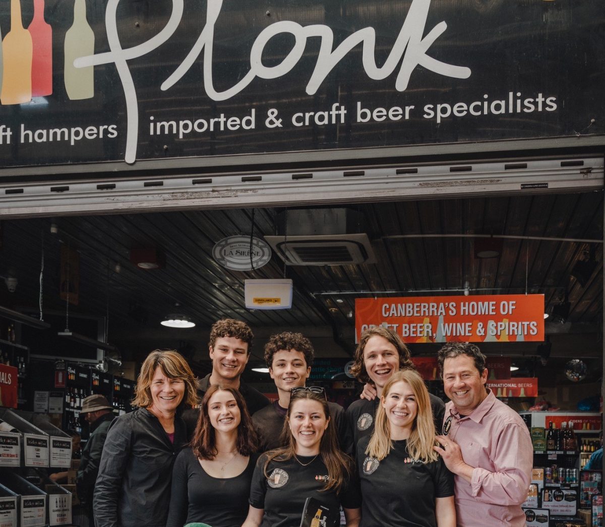 Group of people in Plonk beer and wine shop