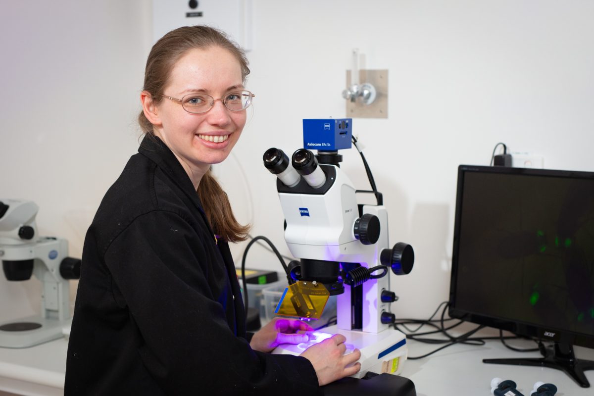 Dr Olga Zaytseva at a microscope