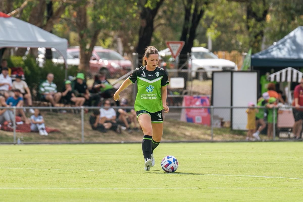 Grace Maher dribbles the ball upfield during a match.