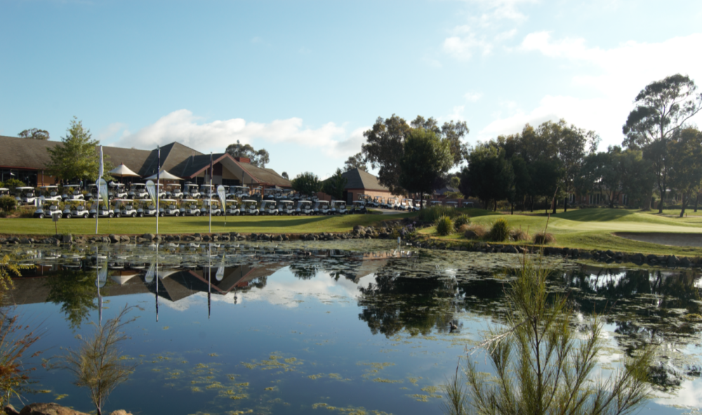 Looking across a pond at a Gold Creek Country Club golf house