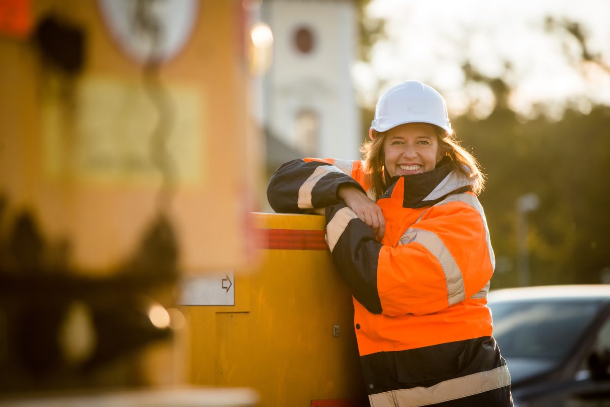 Portrait of senior woman engineer wearing protective workwear - outdoor