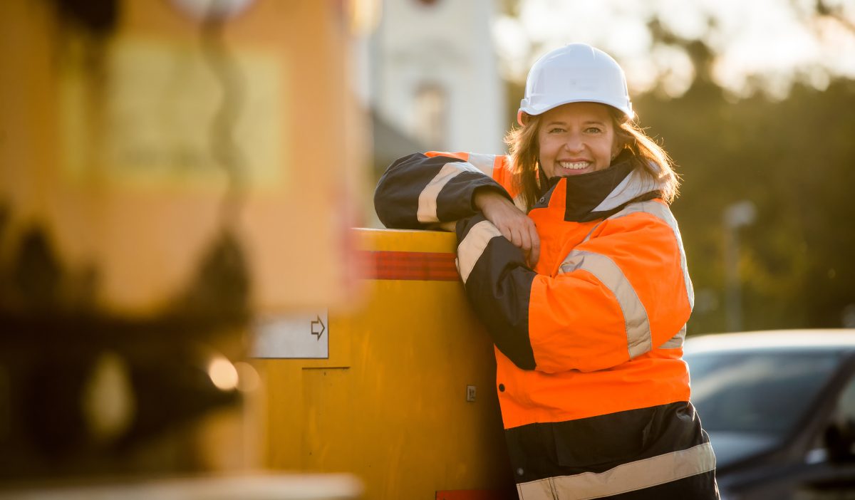 Portrait of senior woman engineer wearing protective workwear - outdoor