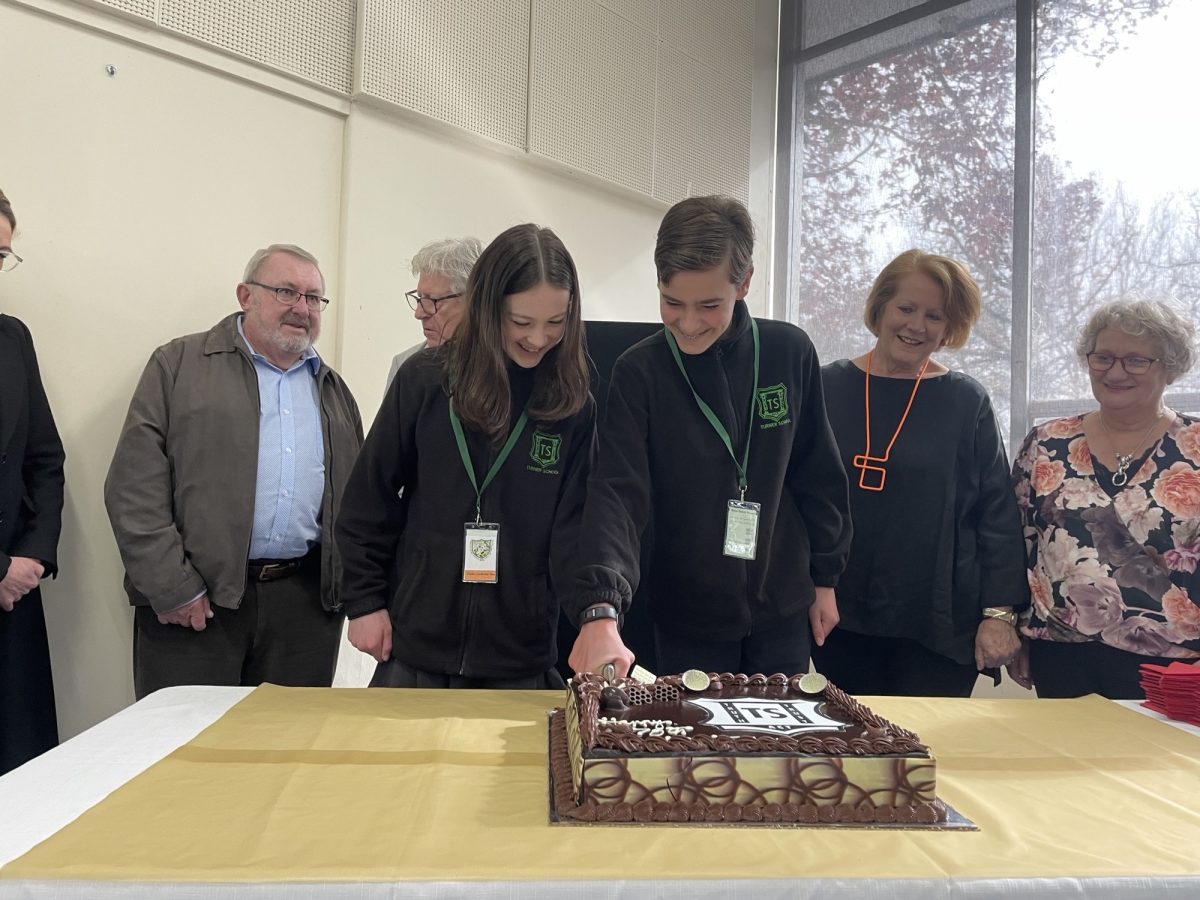 Cutting cake at Turner School.