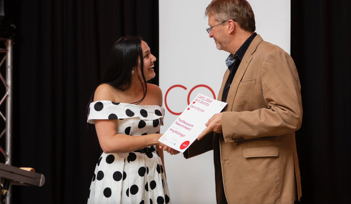 CAPO award recipient Amy McGregor receives her certificate.