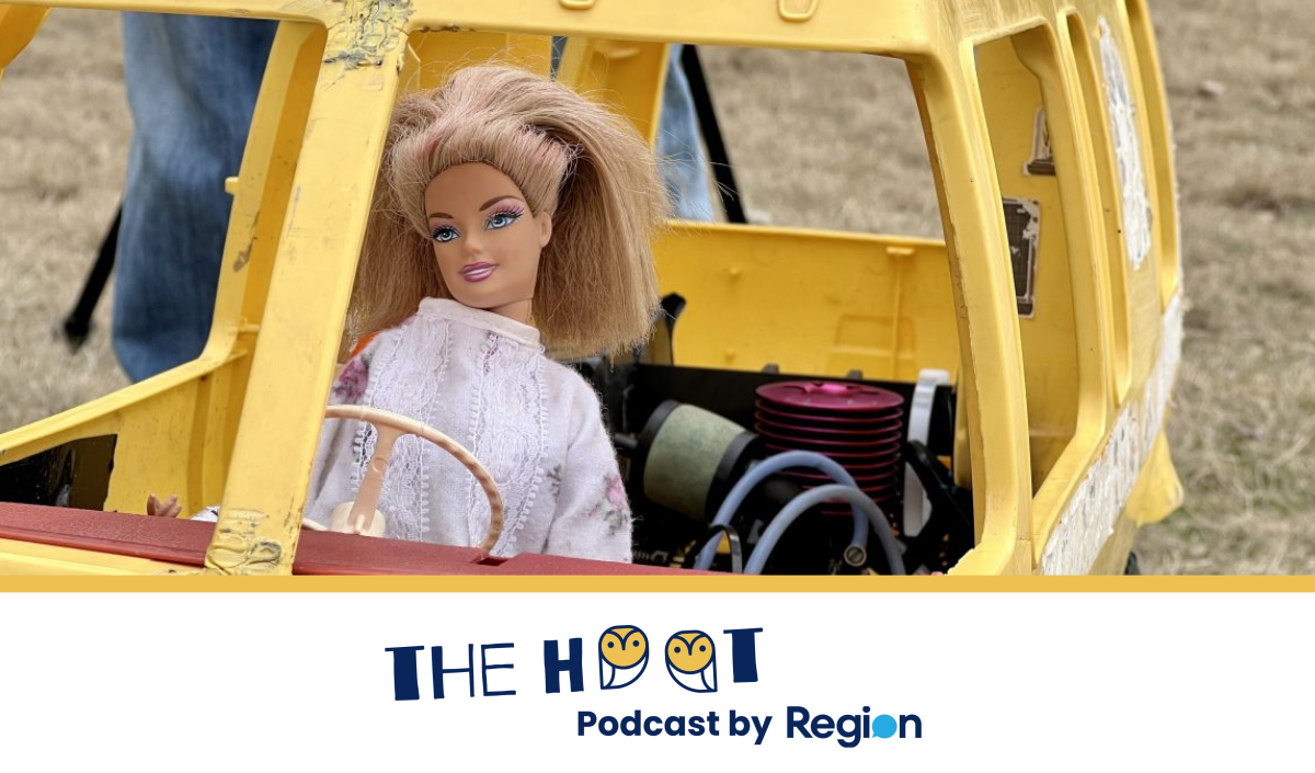 barbie doll in a toy car