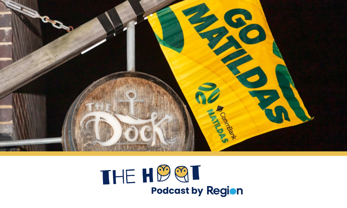 signage for The Dock with the Matildas flag attached