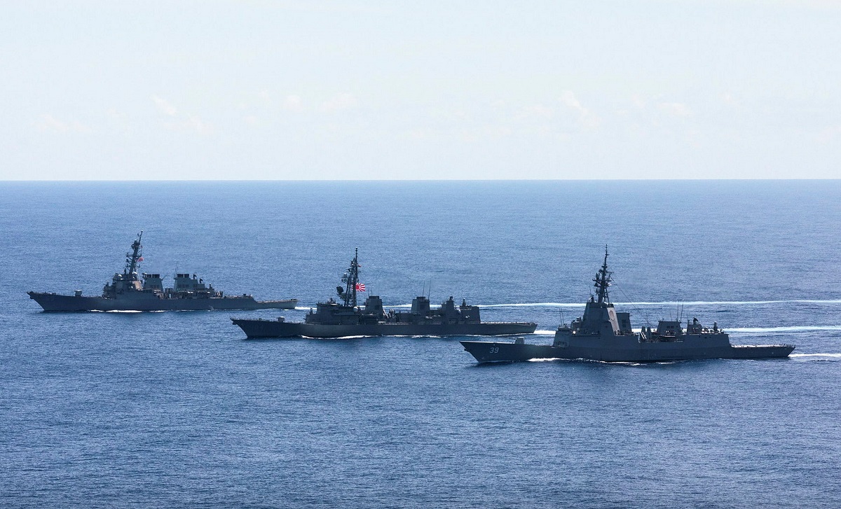 HMAS Hobart sails in formation with Japanese and US destroyers
