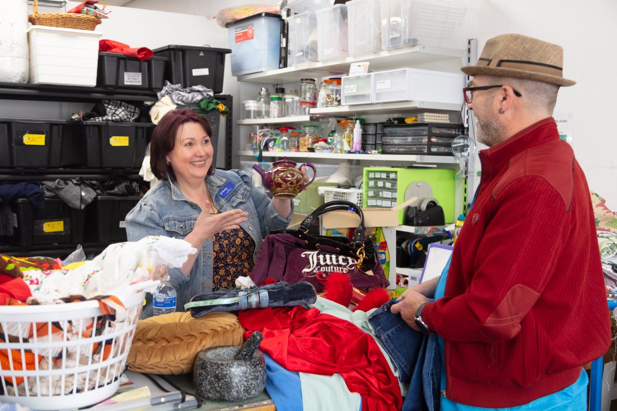 Jo and Gary sorting through donations at Vinnies