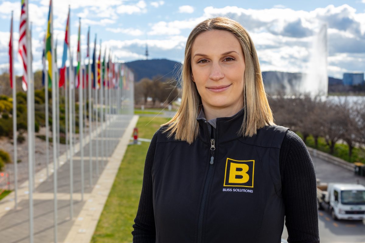 Woman standing outside looking at camera